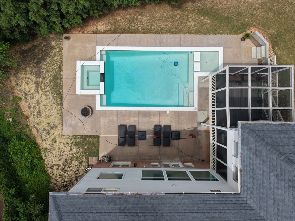Aerial view of the swimming pool, spa and patio at 915 Gunter Ct